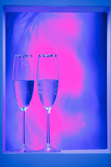 A pair of glasses of champagne in the interior. Holiday's concept.