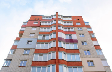 Fototapeta na wymiar Photo of red white modern apartment building