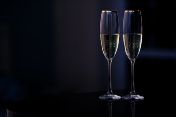A pair of glasses of champagne in the interior. New Year and others holiday concept.