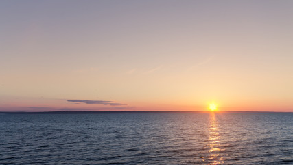 morning dawn on the river / bright rays of the rising sun
