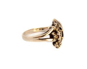 Photo of small gold jewelry decorations isolated on white background