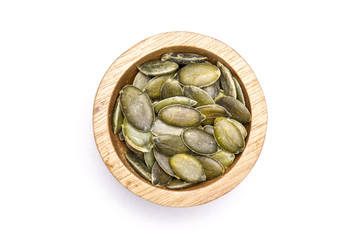 Hulled pumpkin seeds isolated on white