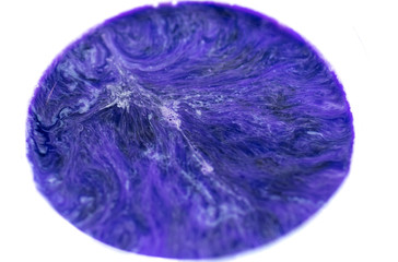 Mixing paints of different colors, drops and splashes close-up