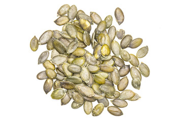 Hulled pumpkin seeds isolated on white
