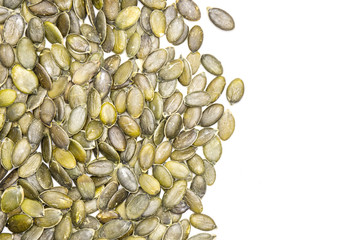 Hulled pumpkin seeds isolated on white