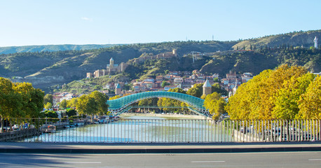 View at Bridge of Peace, Narikala fortress and Tbilisi old town, Georgia. Beautiful sunny autumn day.