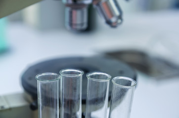 Test tubes on the background of microscope lab