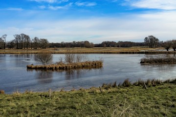 landscape with lake and blue sky