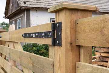 Forged hinges. Forged hinges on the fence ranch style.