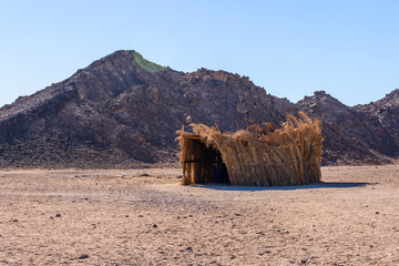 Bedouin building of palm twigs in a desert not far from Hurghada city, Egypt
