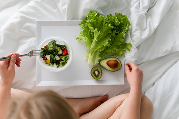 Directly Above Shot Of Woman Having Breakfast On Bed.