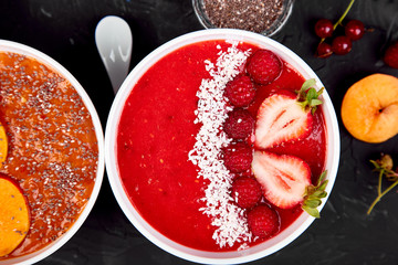 Smoothie with oat or oatmeal, banana and pomegranate on blue background.