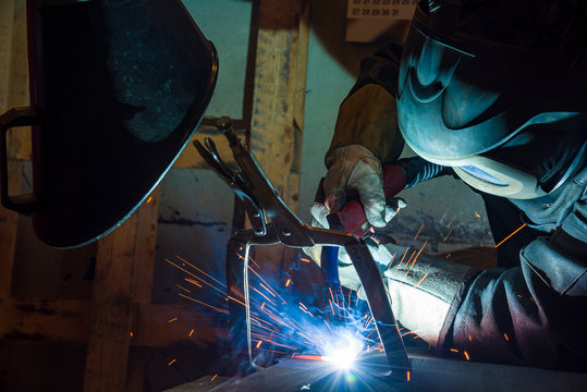 Industrial steel welder in factory welder, craftsman