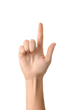 Female hand with raised index finger on white background