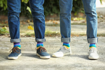 Fototapeta na wymiar Gay couple with colorful socks outdoors