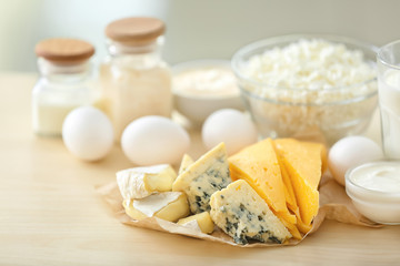 Different milk products on wooden table