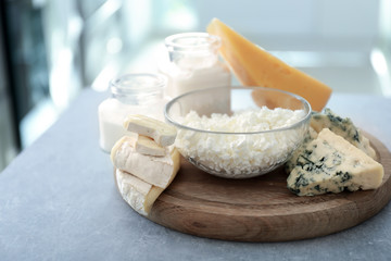 Different milk products on wooden board