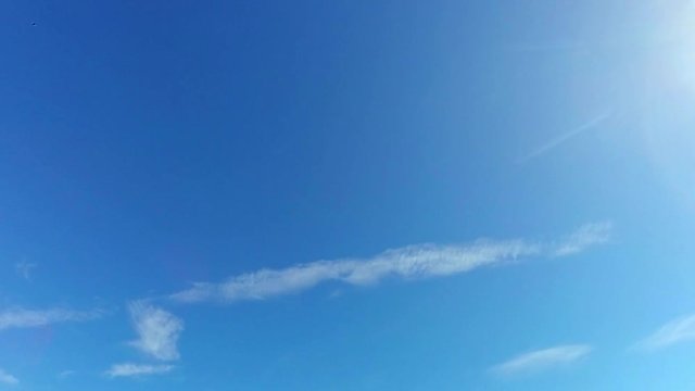 Sparce Clouds Travel Through The Morning