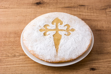 Tarta de Santiago. Traditional almond cake from Santiago in Spain on wooden table
