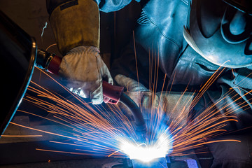 Industrial steel welder in factory welder, craftsman