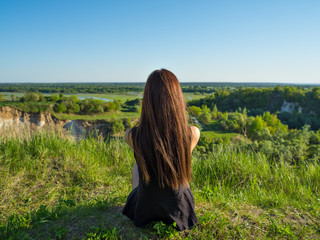 Relaxed young woman looking out into the view.