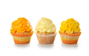 Delicious colorful cupcakes on white background