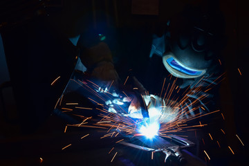 Industrial steel welder in factory welder, craftsman