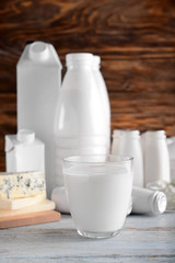 Different milk products on wooden table