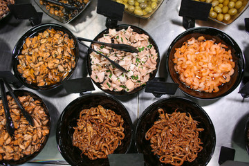 Assortment of tasty seafood on counter in store