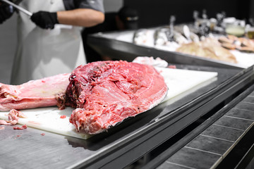 Fresh cut tuna on table in kitchen