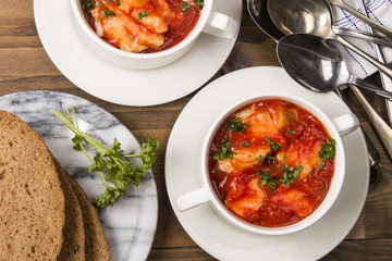 fish soup in a bowl with home baked bread