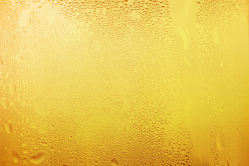 Water vapor in cold Drops of water on a glass of beer , droplets Misted abstract pattern texture background.