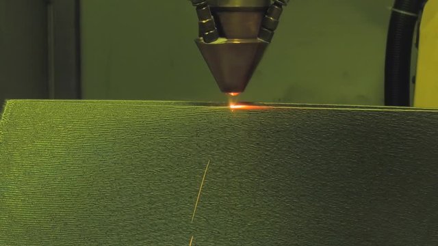 3D metal printer produces a steel part.