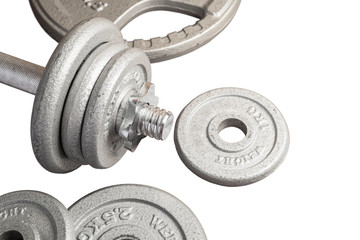 Obraz na płótnie Canvas Dumbbell and Metal Weight Plates on the iSolated White Background