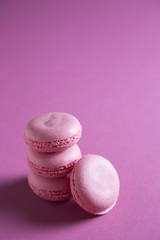 Multi-colored macaroons on a colored background
