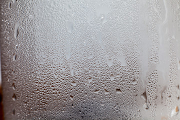 Water vapor in cold glass of Cold water , droplets Misted abstract pattern texture background.