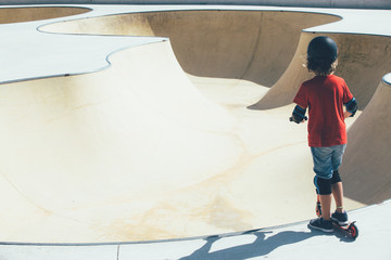 Child in the urban skate park