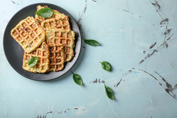 Plate with tasty squash waffles on light table