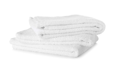 Stack of clean soft towels on white background