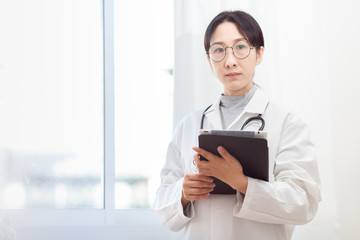 Doctor Asian woman, medical professional Are working for gesture up confidence Let the patient .