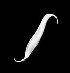 Splash of milk on black background