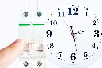 Electrician turns of the switch. Power outage. Energy saving concept. the time has come.