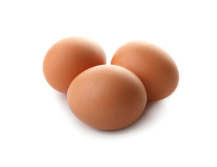 Raw chicken eggs on white background