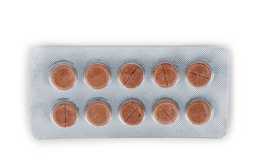Pills in a pack on a white background