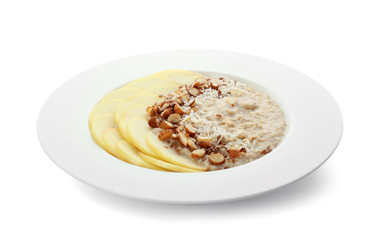 Plate with tasty oatmeal on white background