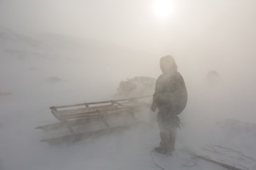 Nenets reindeer herder on a winter day © Shchipkova Elena