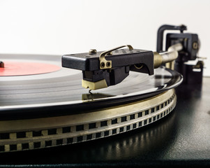 Fototapeta na wymiar Retro turntable vinyl record player. Vintage record player. Old analog audio equipment for sound enthusiast and professional disc jockey