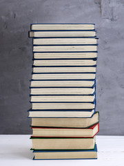 stack of books in a blue cover