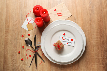 Festive table setting for Valentines Day celebration on wooden table