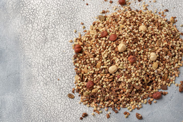 Healthy breakfast, vegan vegetarian granola made of green buckwheat with nuts and pumpkin seeds